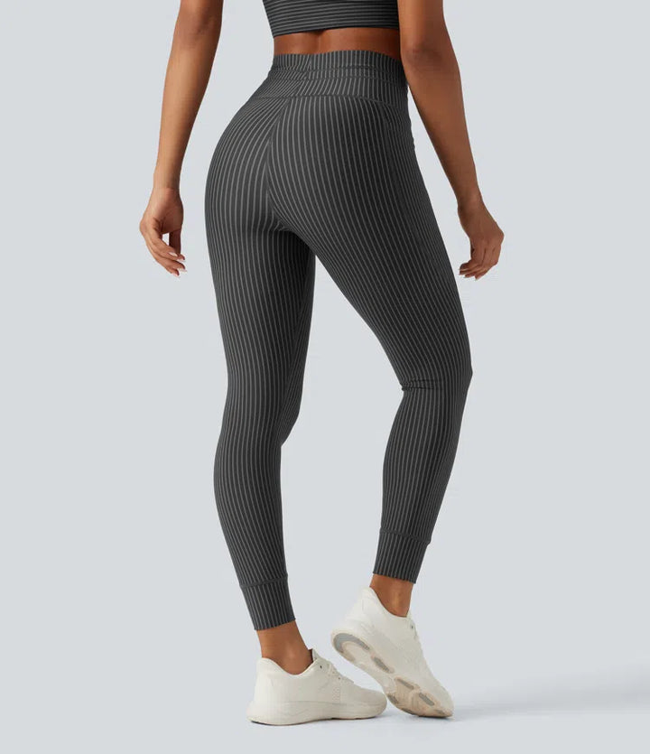 Legginsy do jogi w paski z wysokim stanem, sznurkiem w pasie i kieszeniami.