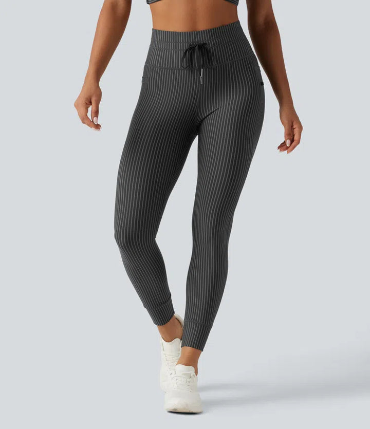Legginsy do jogi w paski z wysokim stanem, sznurkiem w pasie i kieszeniami.