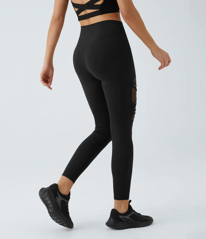 DayStretch legginsy do jogi z wysokim stanem, krzyżowanym przodem, kontrastową siateczką i ozdobną klamrą