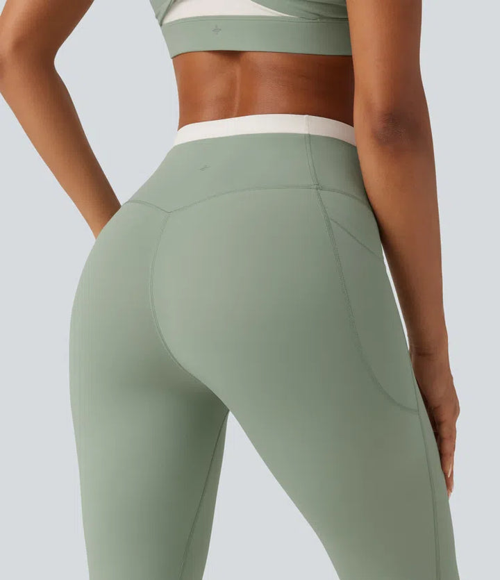 Halara UltraSculpt dopasowane legginsy do jogi z wysokim stanem, efektem modelującym brzuch, w designie color block i kieszeniami.