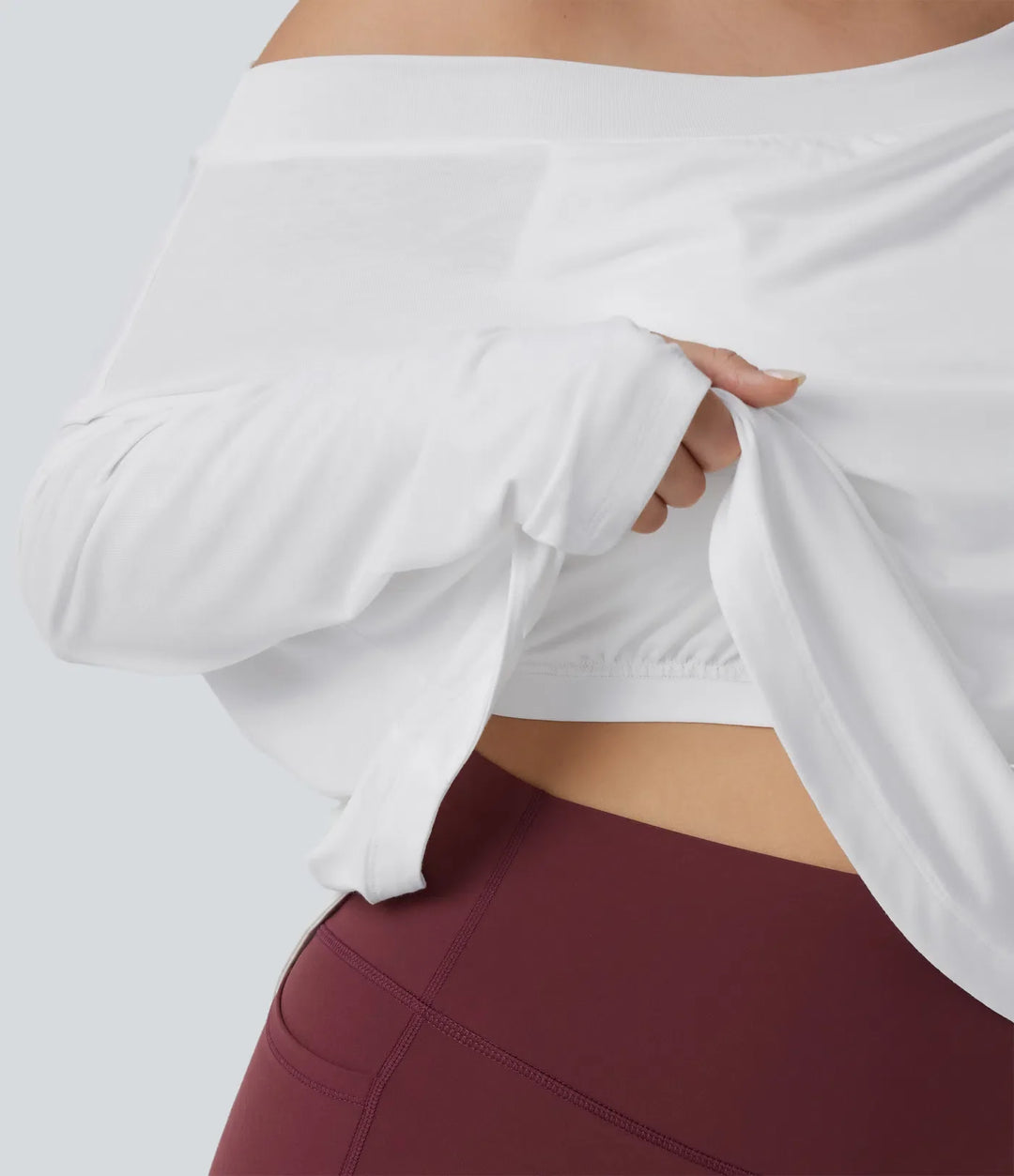 Na jedno ramię z długim rękawem z otworem na kciuk z zaokrąglonym dołem High Low szybkoschnący joga plus size top sportowy-z wbudowanym biustonoszem