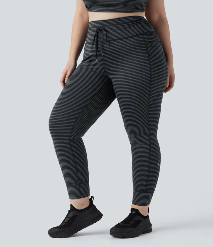 Legginsy do jogi w paski z wysokim stanem, wiązaniem na sznurek i kieszeniami — rozmiar plus