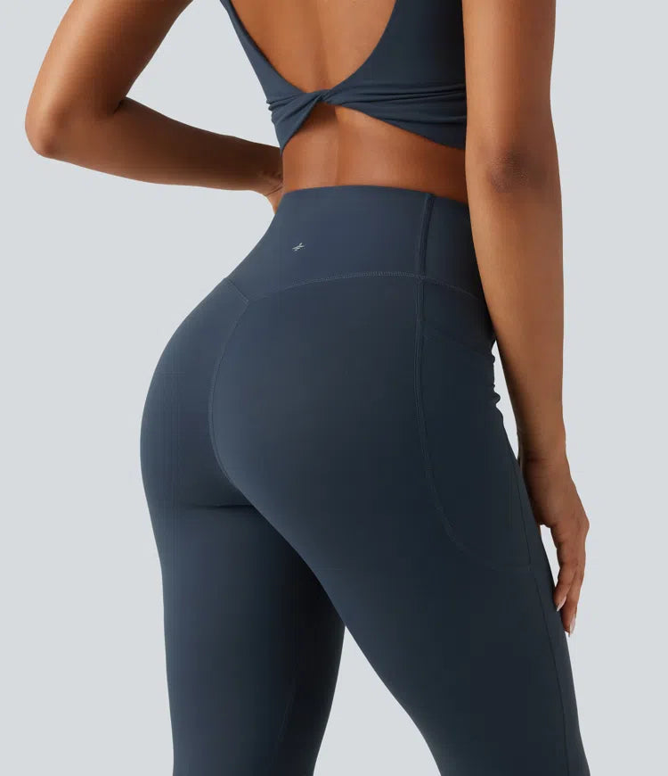 Halara UltraSculpt legginsy treningowe z wysokim, skrzyżowanym stanem, modelujące brzuch, z rozkloszowanymi nogawkami i kieszeniami