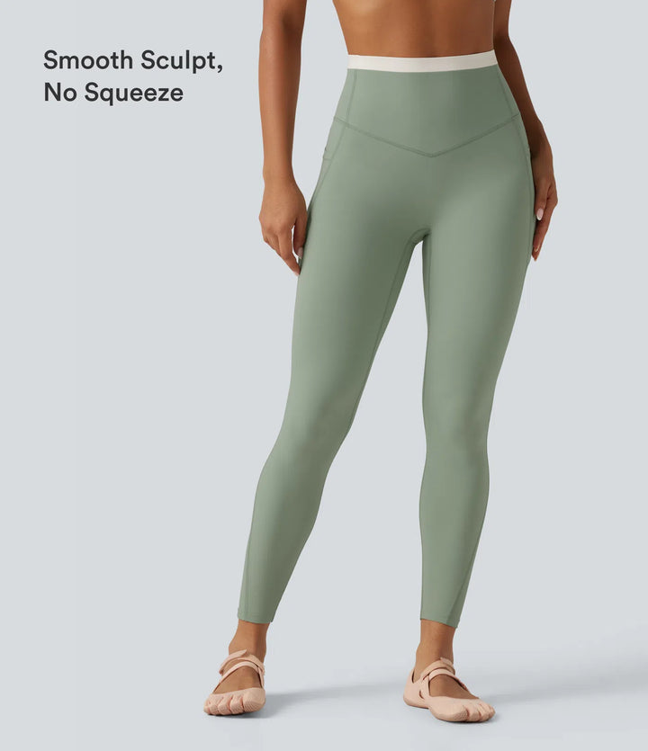 Halara UltraSculpt dopasowane legginsy do jogi z wysokim stanem, efektem modelującym brzuch, w designie color block i kieszeniami.