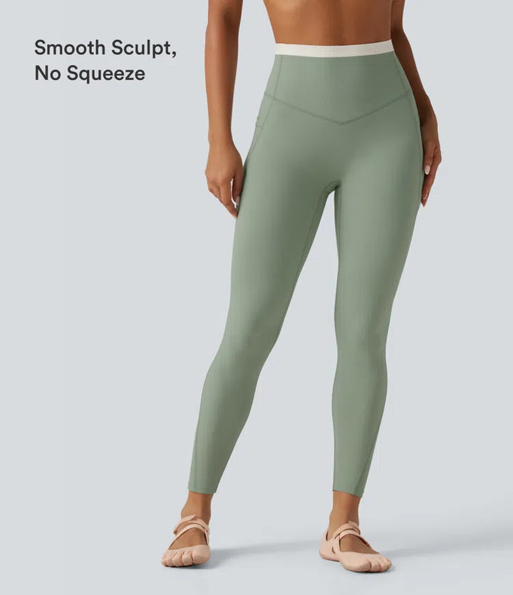Halara UltraSculpt dopasowane legginsy do jogi z wysokim stanem, efektem modelującym brzuch, w designie color block i kieszeniami.