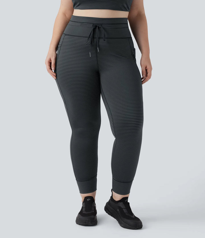 Legginsy do jogi w paski z wysokim stanem, wiązaniem na sznurek i kieszeniami — rozmiar plus